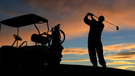 man golfing at sunset