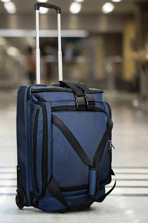 first class carry-on duffel blue at airport